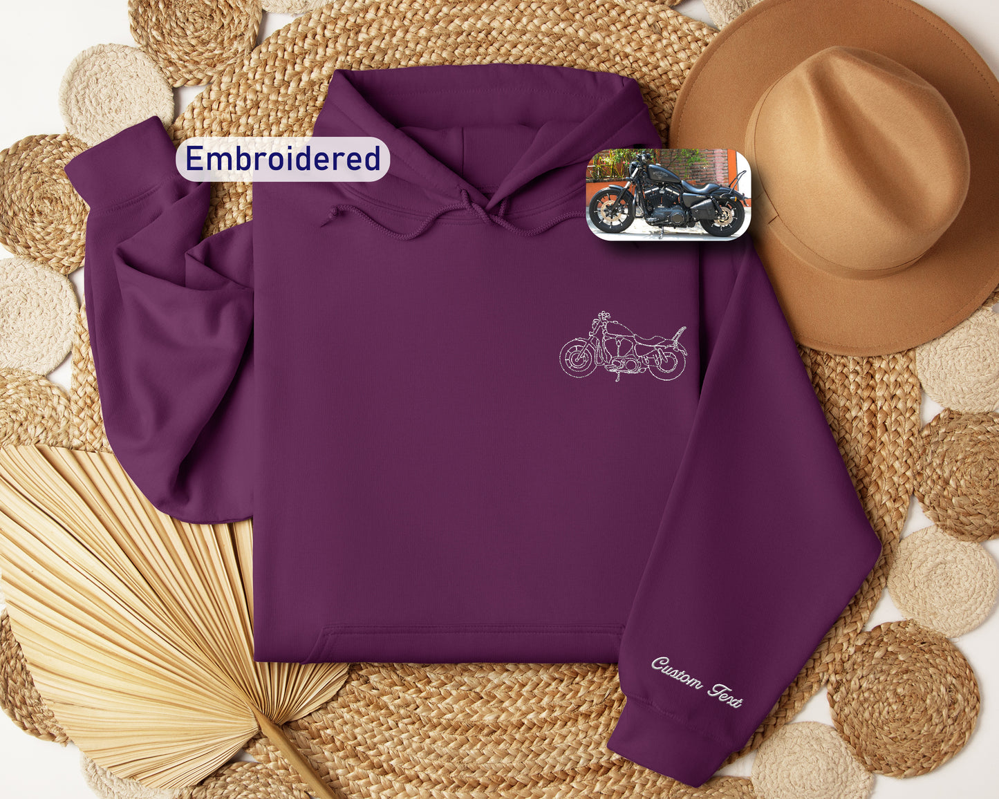 a purple hoodie with a picture of a motorcycle on it