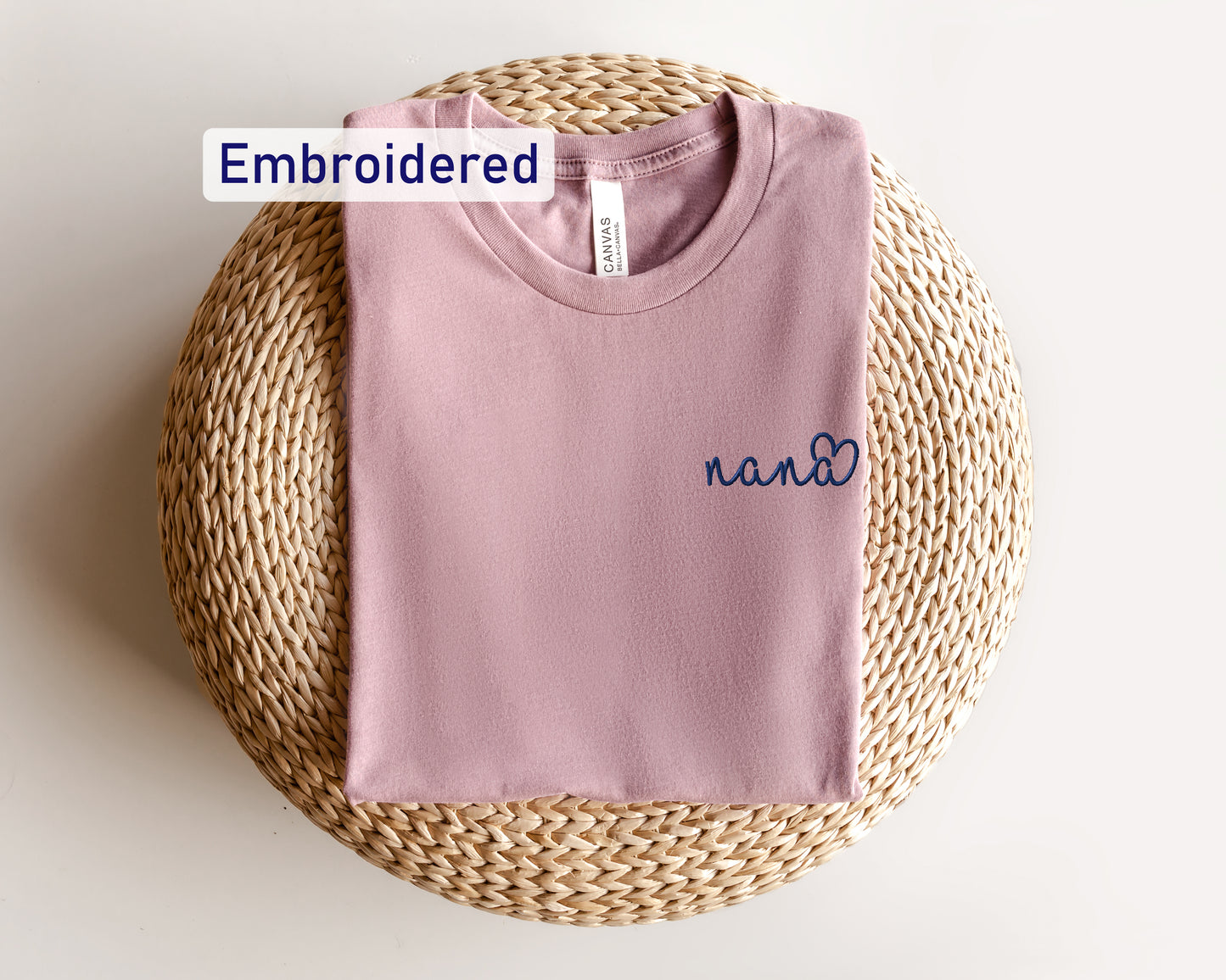 a pink t - shirt with the name nann written on it