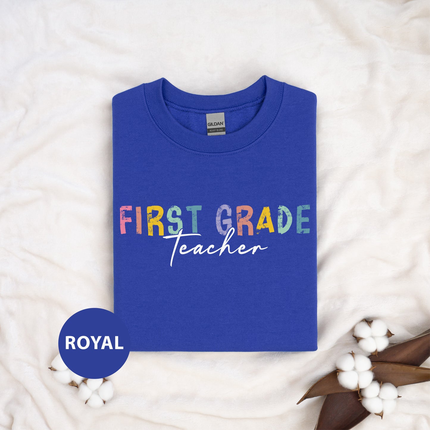 a blue shirt with the words first grade teacher on it