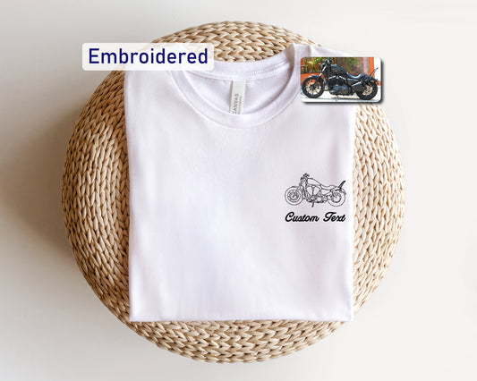 a white t - shirt with a picture of a motorcycle on it