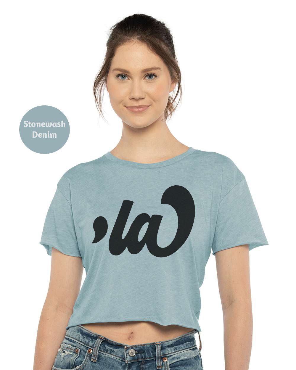 a woman wearing a blue crop top with the word g on it