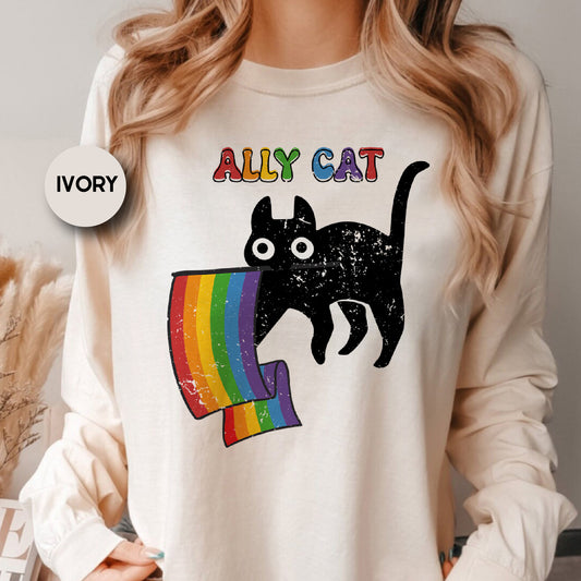 a woman wearing a white shirt with a black cat on it