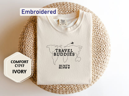 a white t - shirt with the words travel buddies printed on it