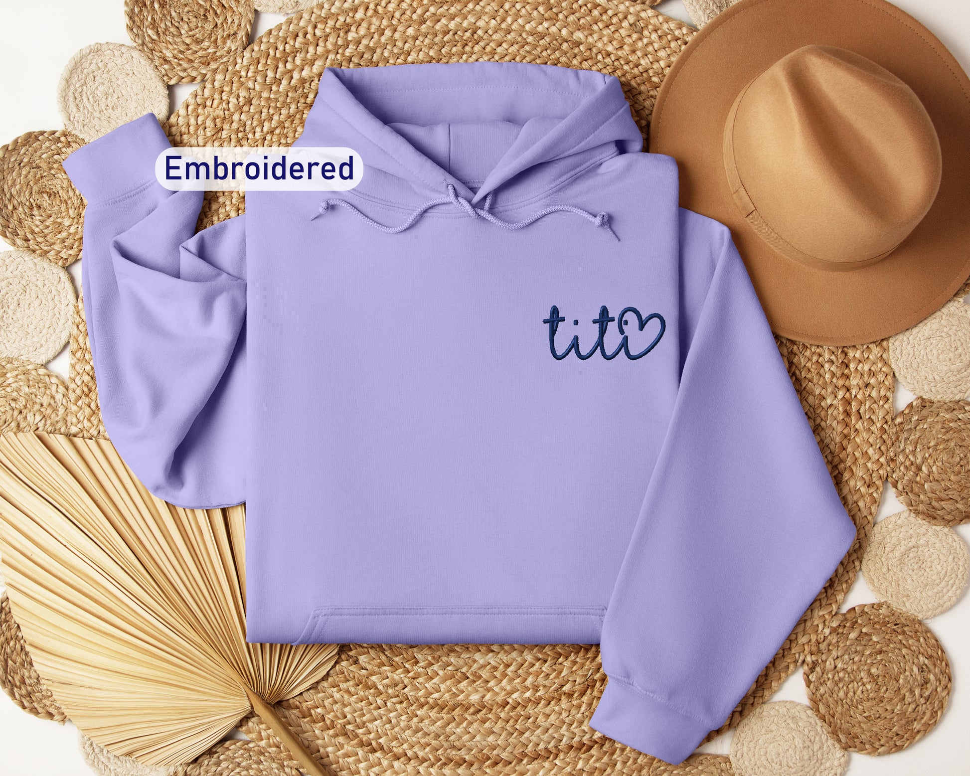 a purple hoodie with the word tico embroidered on it