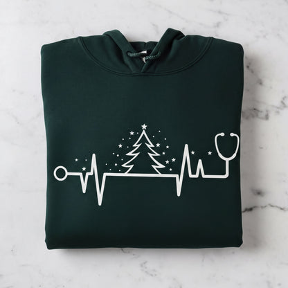 A dark green hoodie with a white graphic design depicting a stethoscope and a Christmas tree with stars.