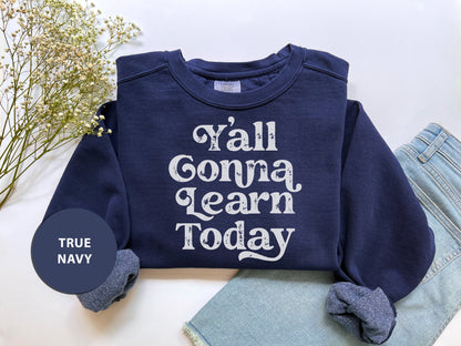 a blue sweatshirt with the words y'all gona learn today printed on it