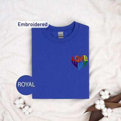 a blue t - shirt with the word love embroidered on it