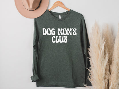 a green shirt that says dog mom's club on it