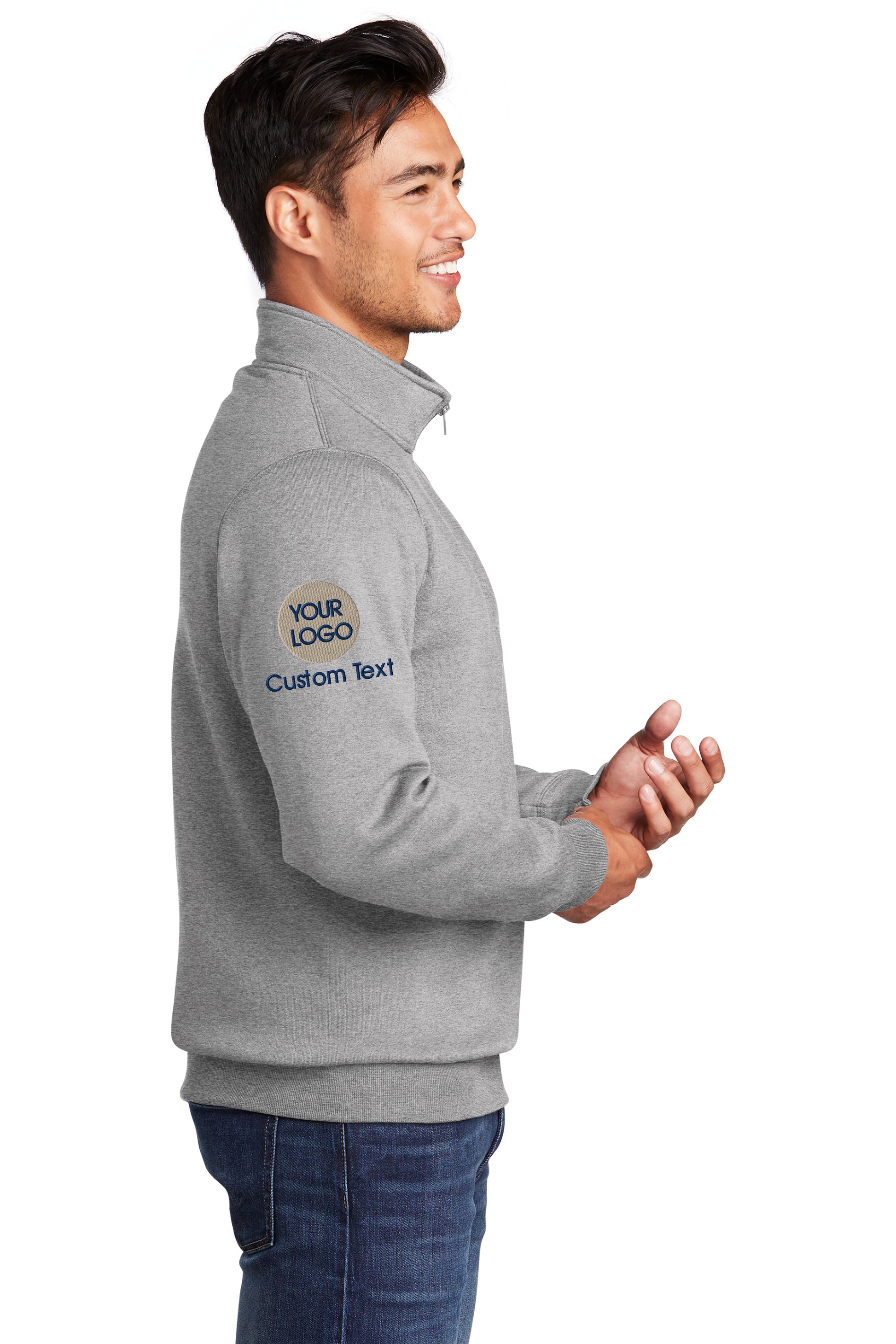 a man wearing a gray sweatshirt with a logo on it