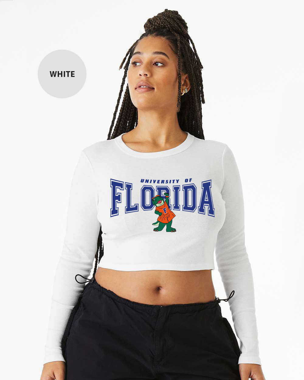 a woman wearing a white crop top with florida on it