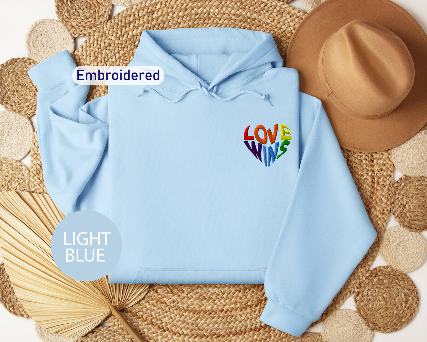 a light blue hoodie with the word love on it