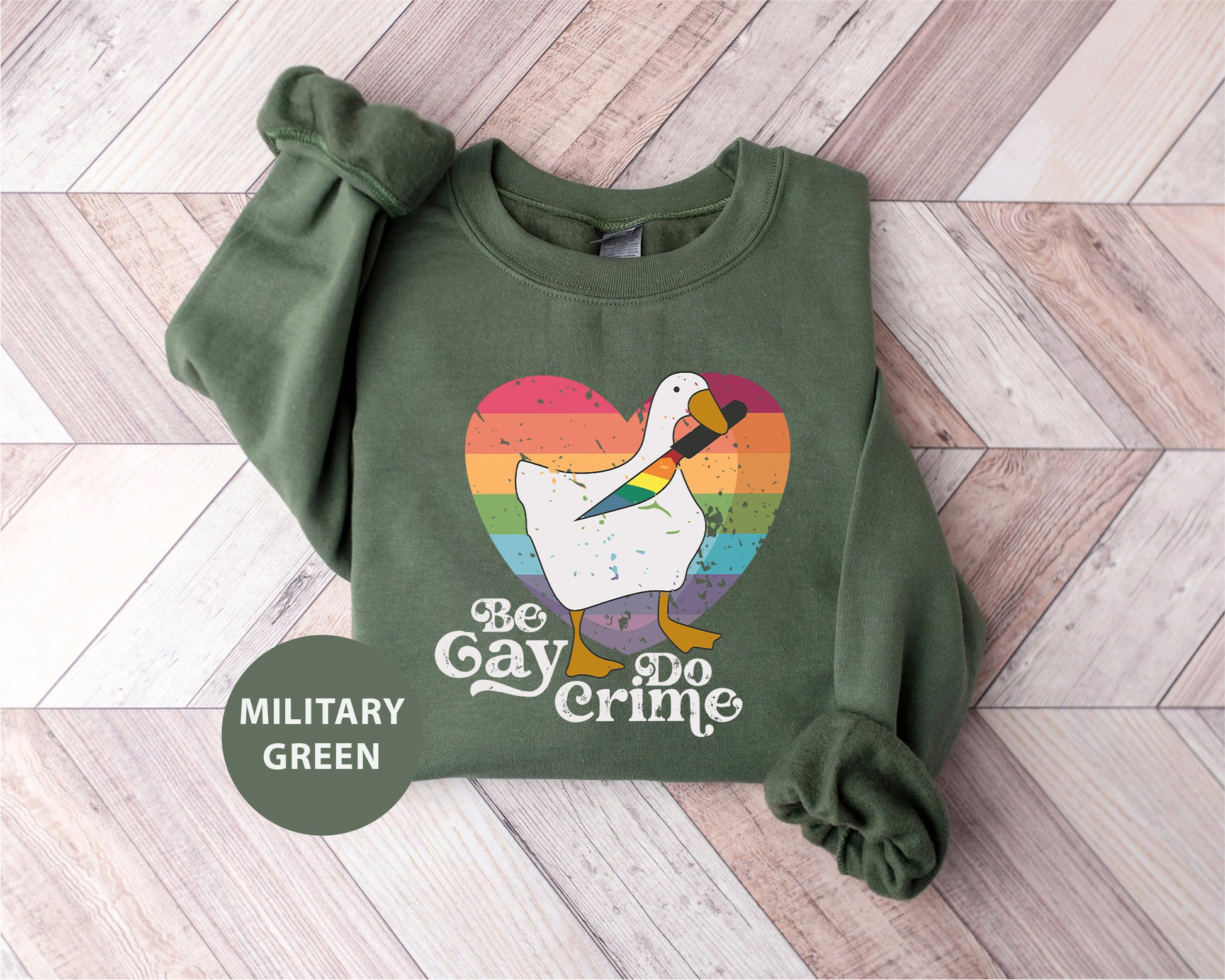 a green sweatshirt with a picture of a duck on it