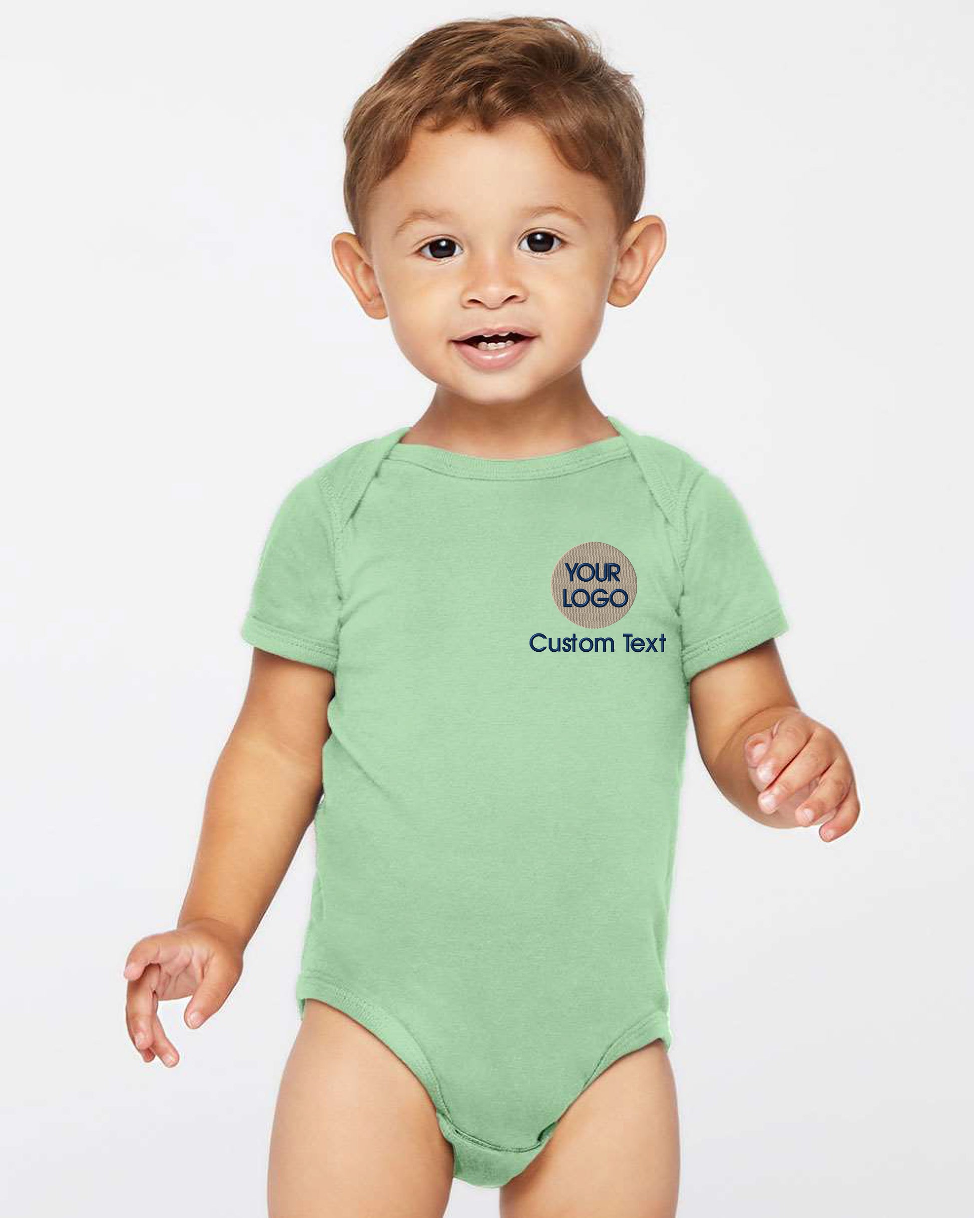 a baby boy wearing a green bodysuit with the words custom text on it