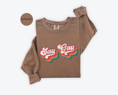 a brown shirt with the words stay gay on it