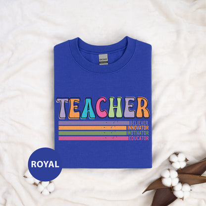 a blue t - shirt with the words teacher on it