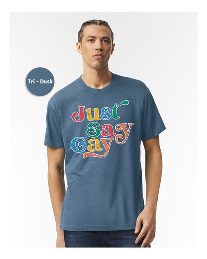 a man wearing a blue t - shirt that says just gay