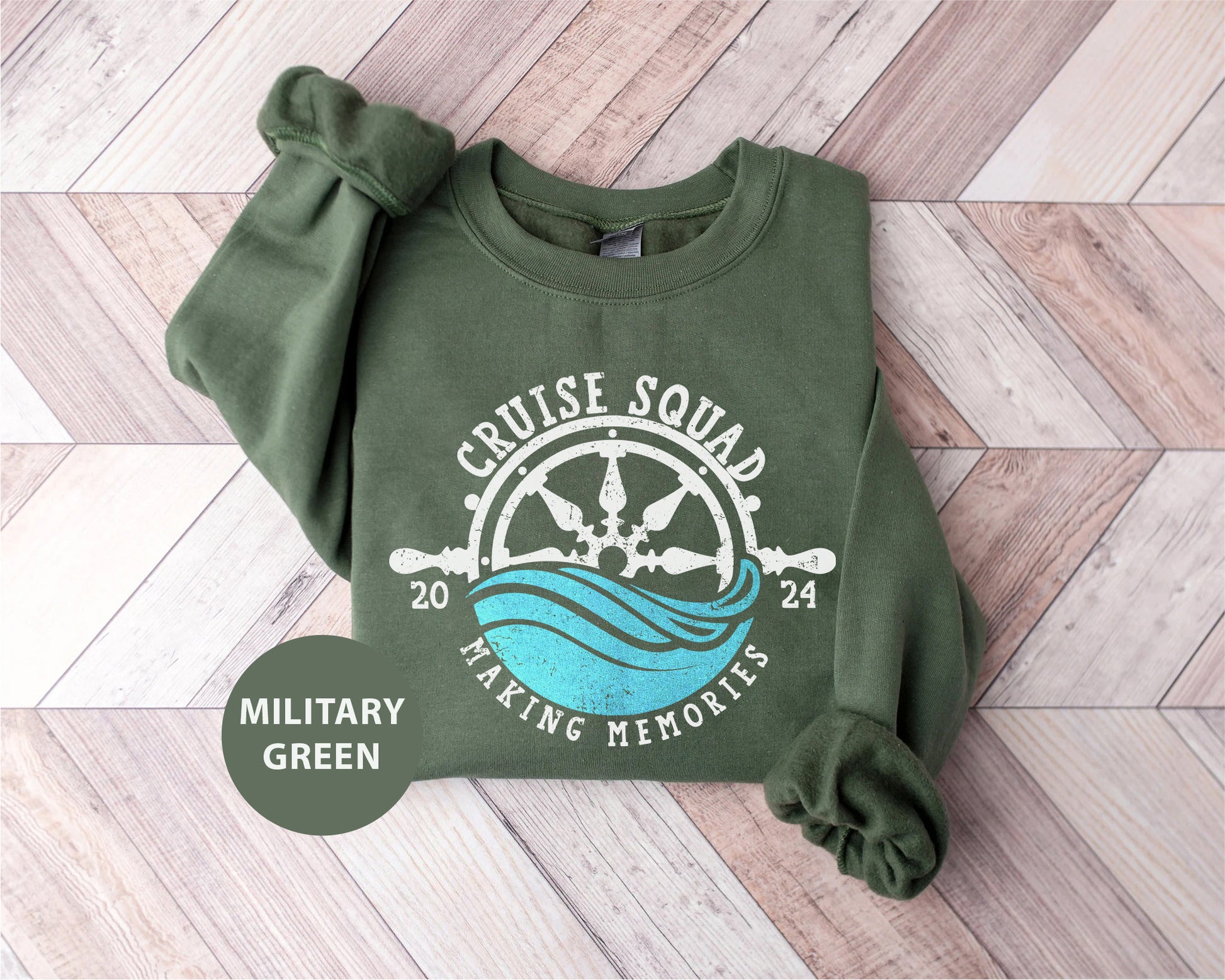 a green sweatshirt with a boat wheel on it