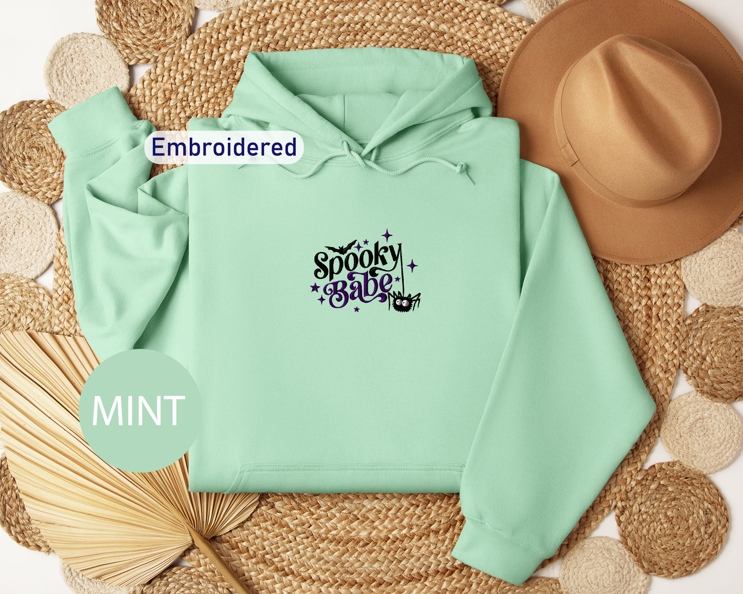 a mint green hoodie with the words spooky bubble printed on it