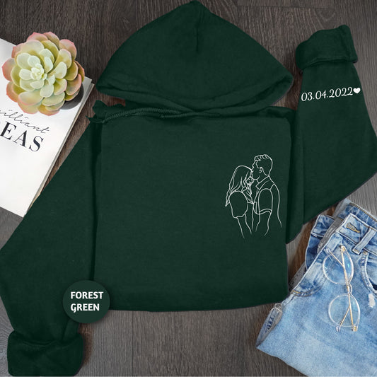 a green hoodie with a picture of a man and a woman on it