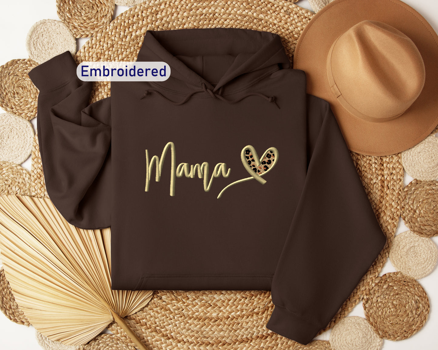 a brown hoodie with the word mama printed on it