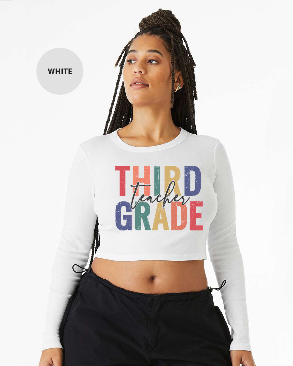 a woman wearing a white crop top that says third grade