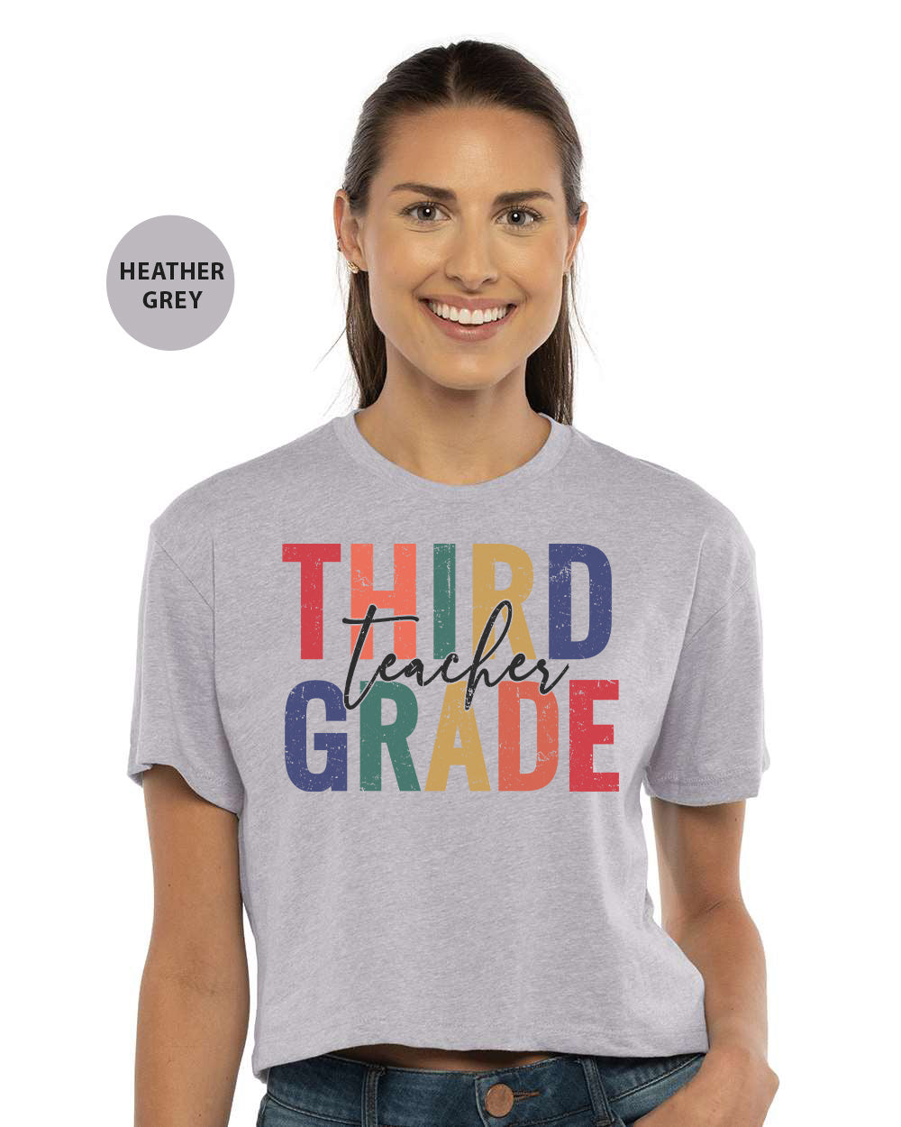 a woman wearing a t - shirt that says third grade