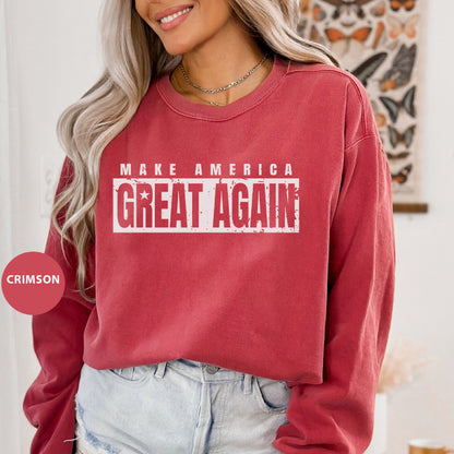 a woman wearing a red sweatshirt that says make america great again