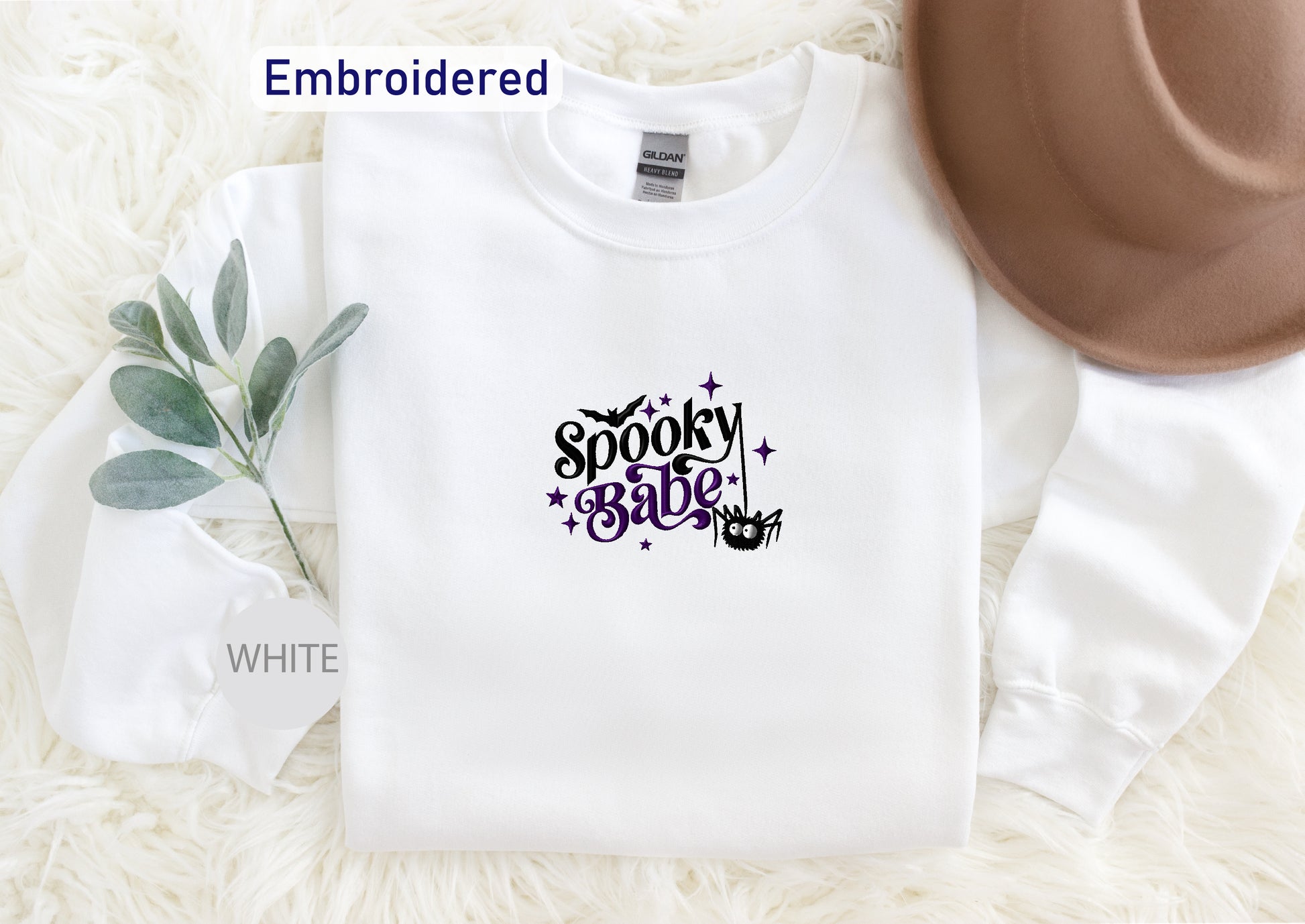 a white sweatshirt with the words spooky spooky on it