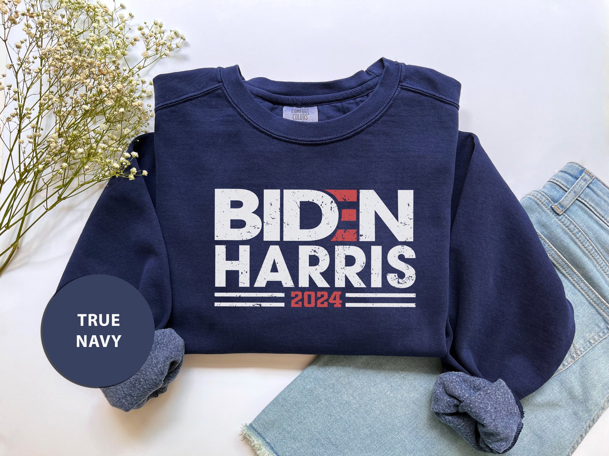 a blue shirt that says bidn harris next to a pair of jeans