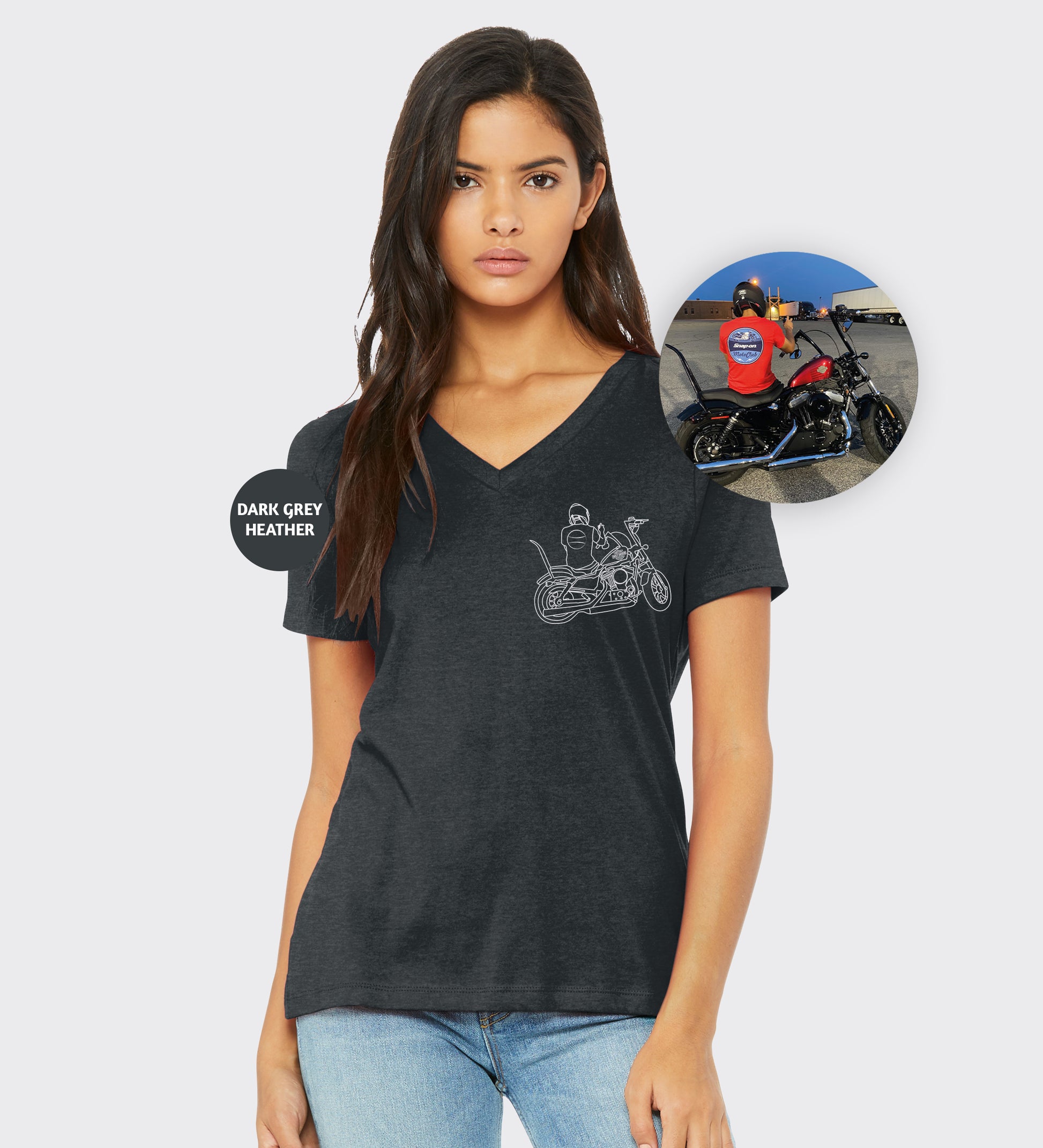 a woman wearing a black v - neck shirt with a picture of a motorcycle