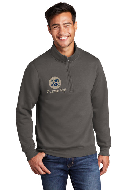 a smiling man wearing a gray sweatshirt with the logo of a boat on it