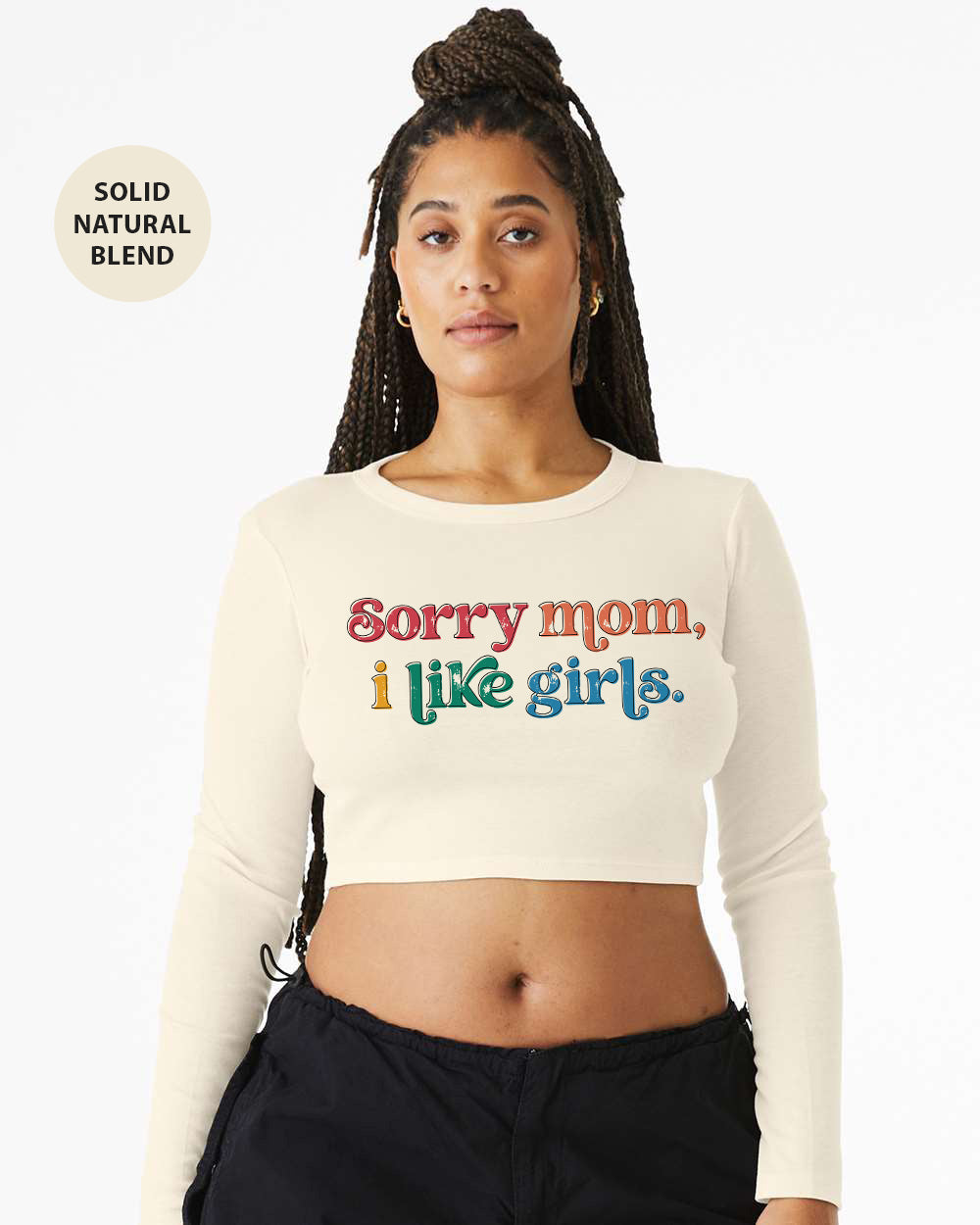 a woman wearing a white crop top that says sorry mom, i like girls