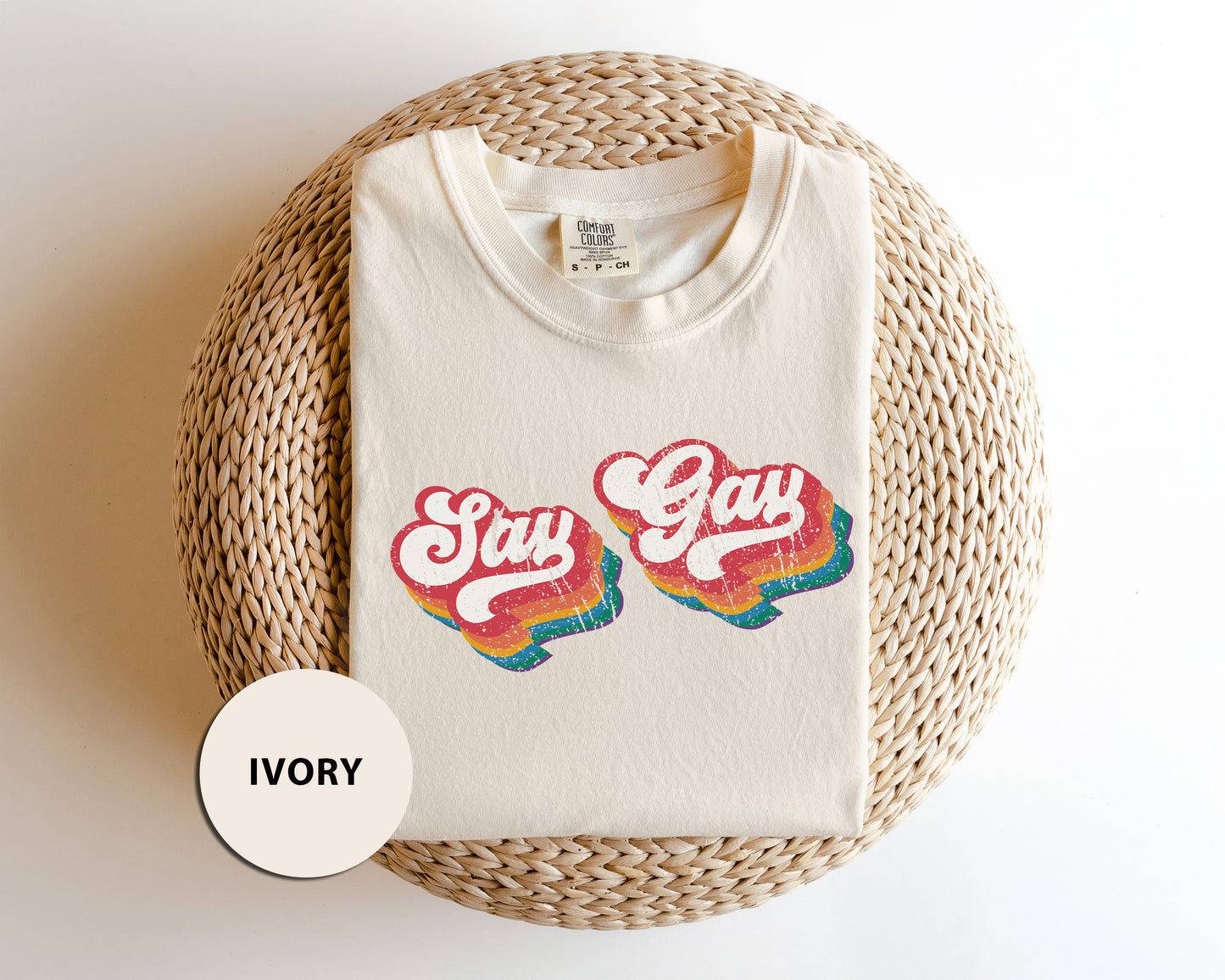 a white t - shirt with the words stay gay printed on it