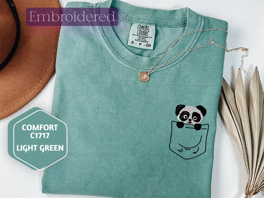 a t - shirt with a panda in a pocket on it