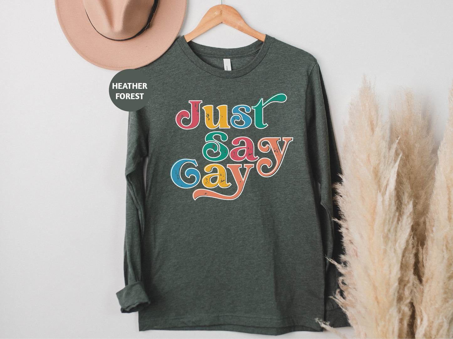 a t - shirt that says just sasy gay on it