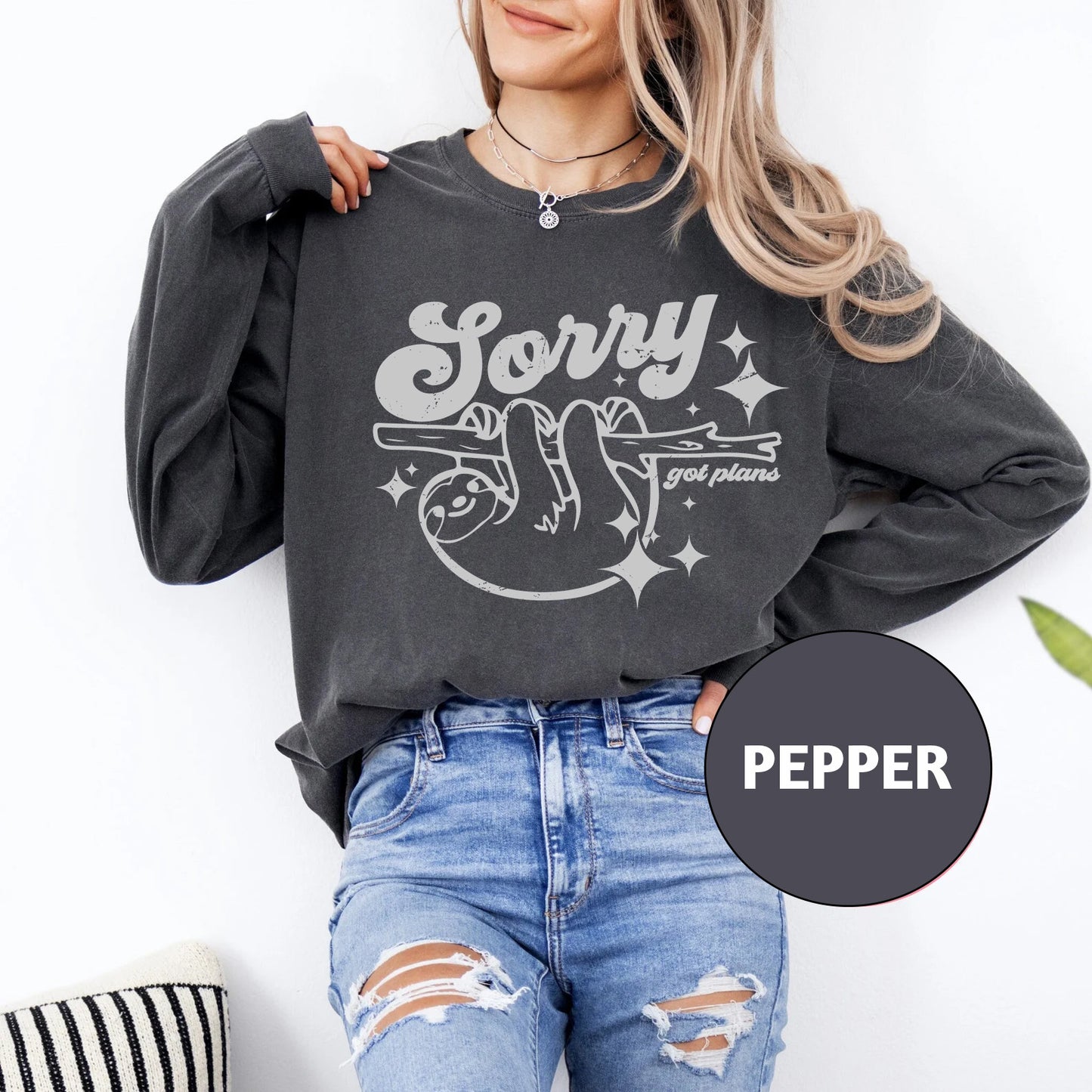 a woman wearing a black sweatshirt with the slogan sorry and friends on it