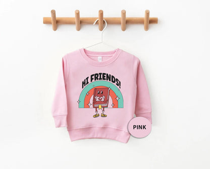 a pink sweatshirt hanging on a clothes line