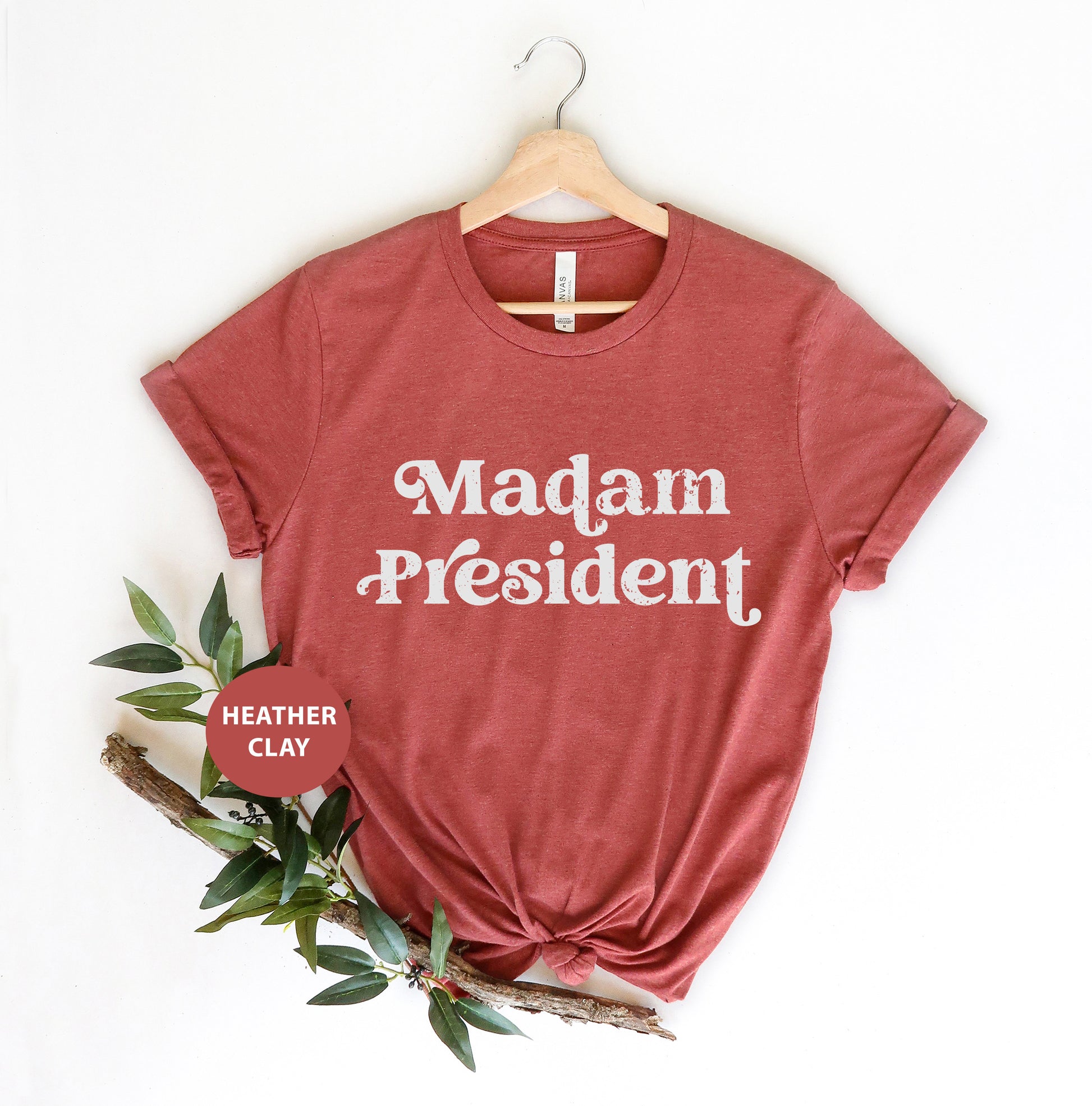 a red shirt that says madam president on it