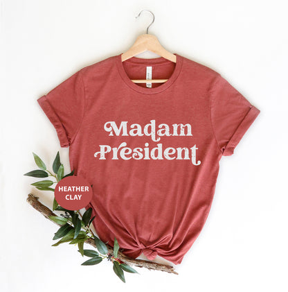 a red shirt that says madam president on it