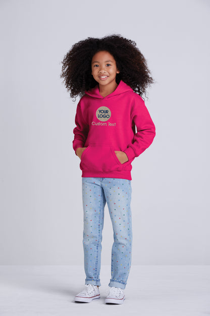 a young girl wearing a pink hoodie and jeans