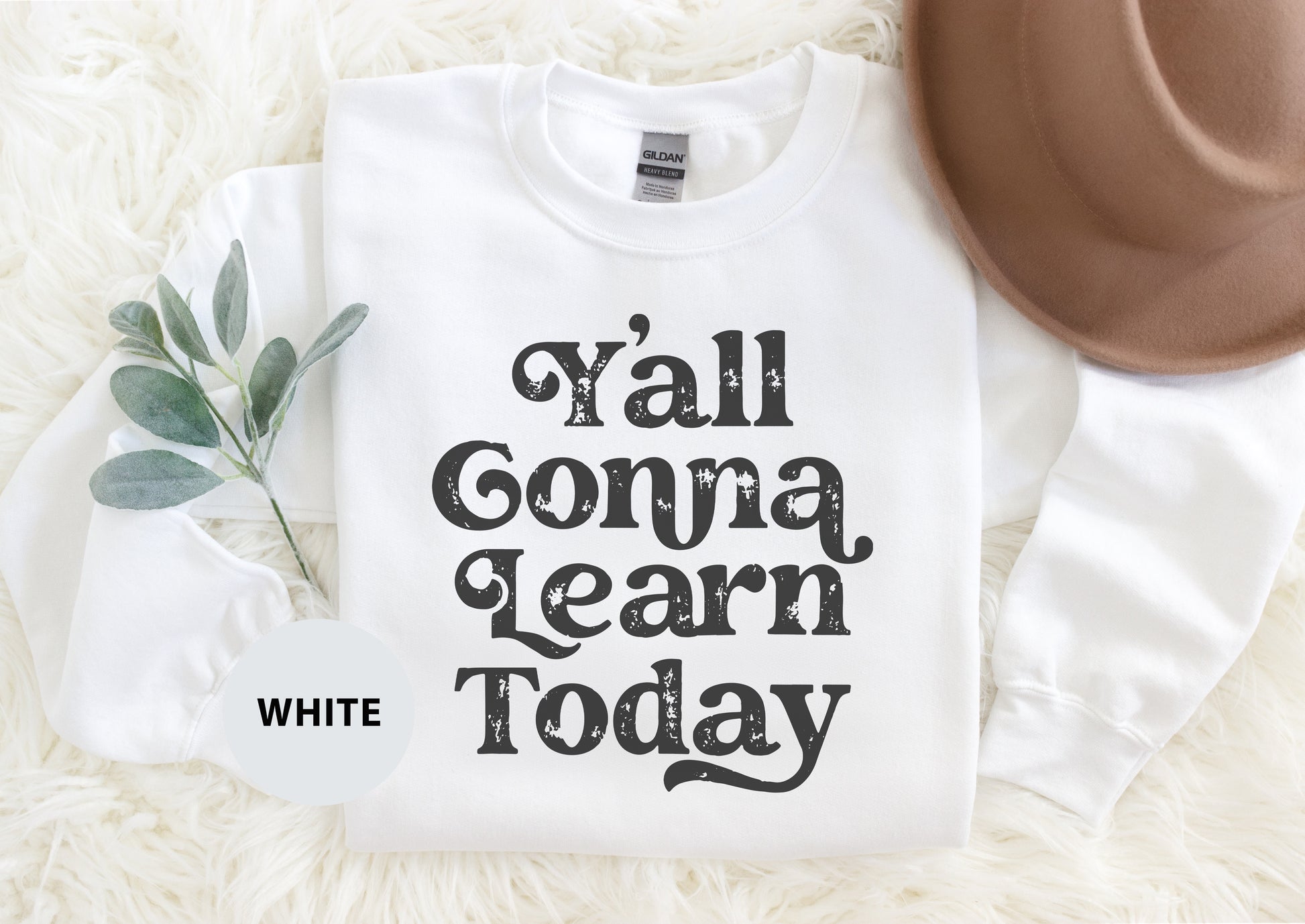 a white shirt that says y'all conna learn today