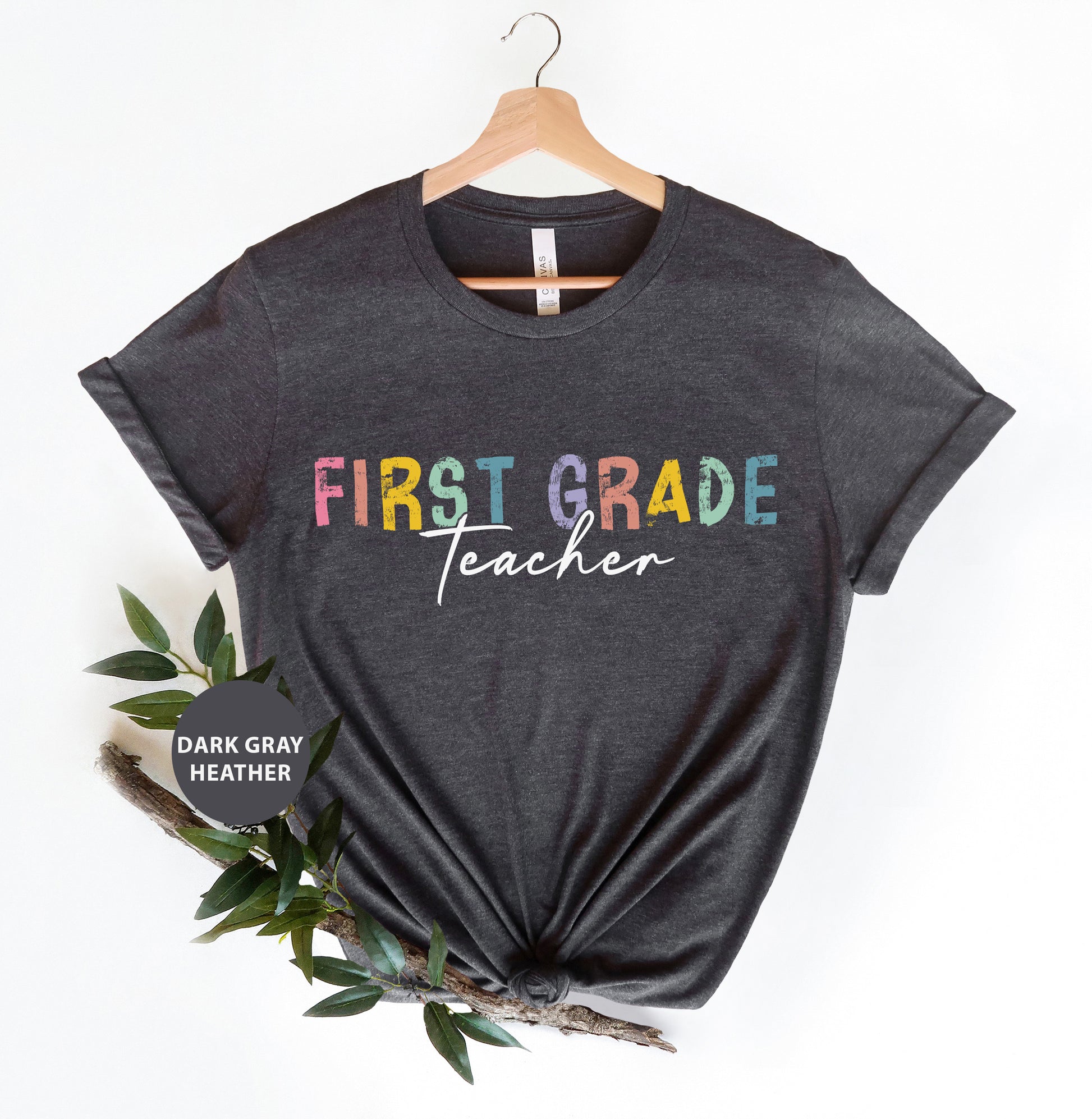 a t - shirt with the words first grade teacher on it