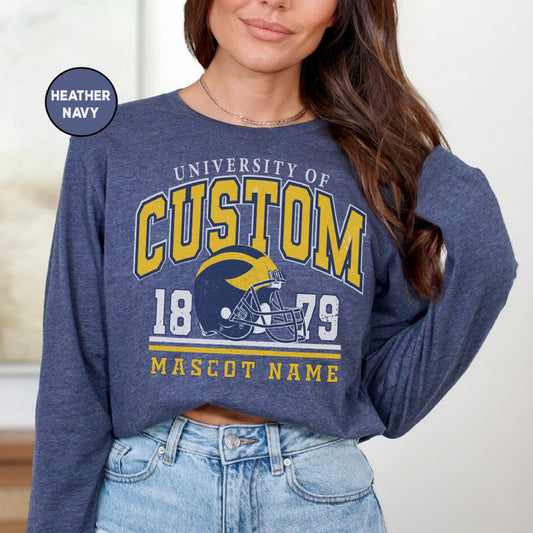 a woman wearing a sweatshirt with a football helmet on it