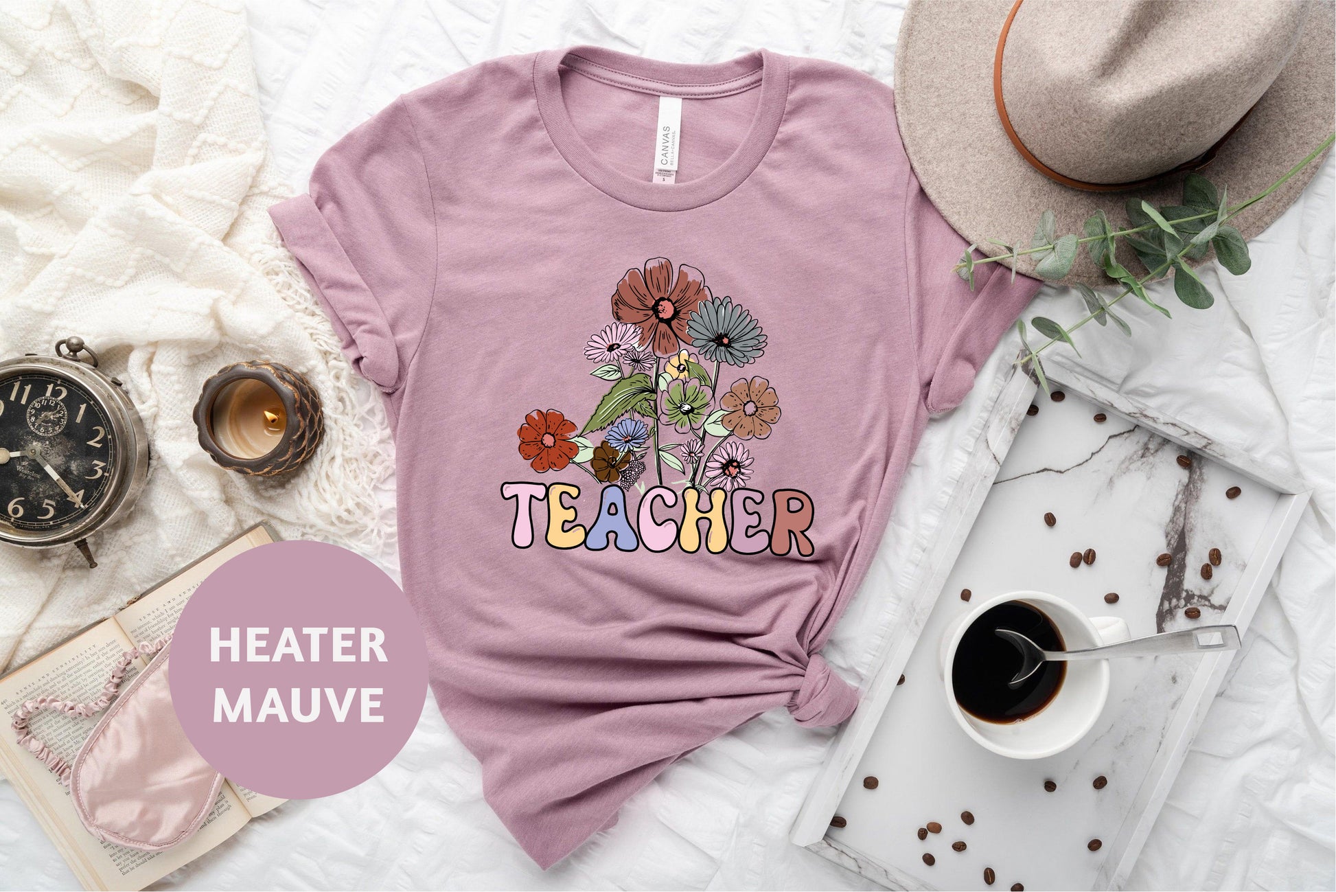 a t - shirt that says teacher with flowers on it