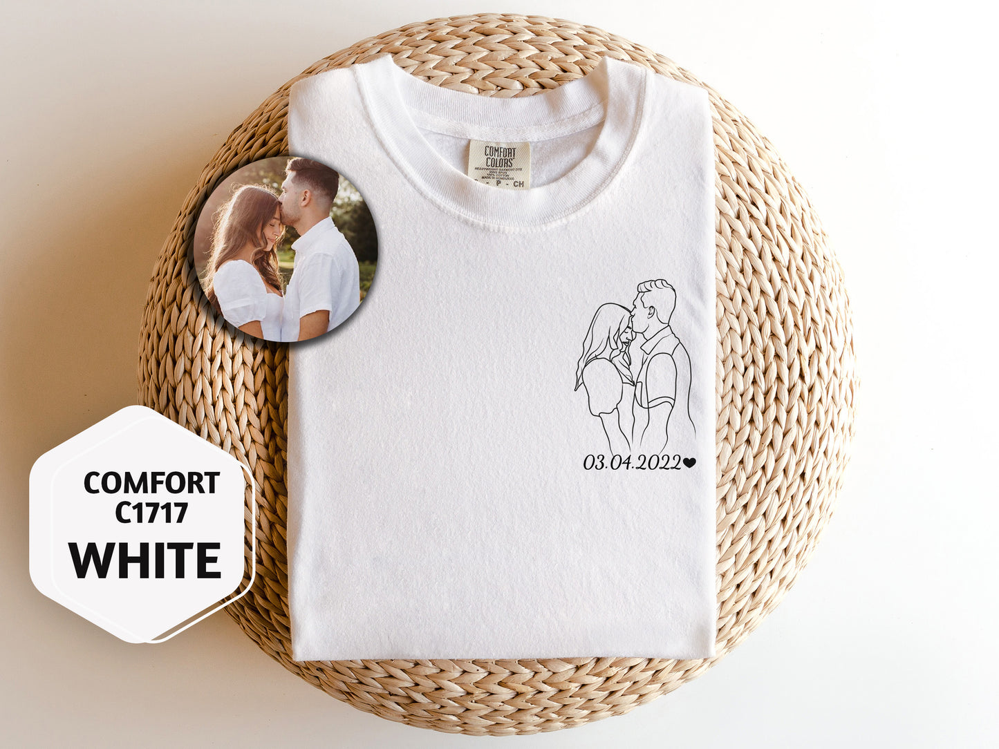 a white t - shirt with a picture of a man and a woman on it