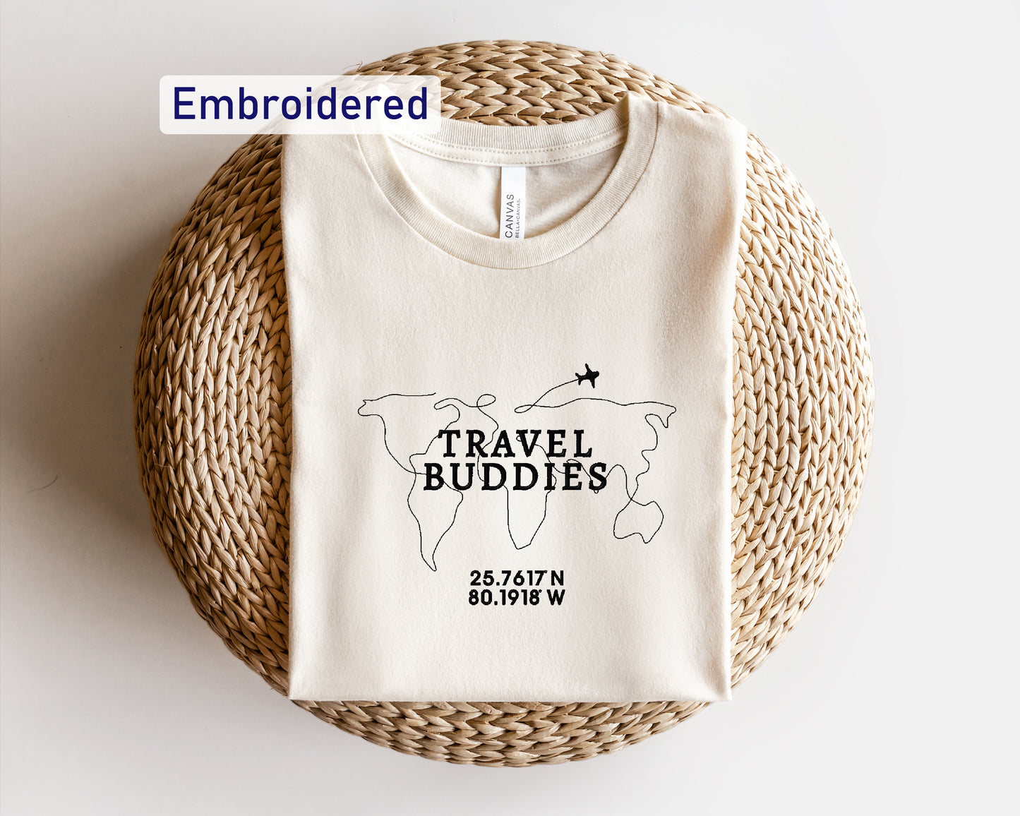 a white t - shirt with the words travel buddies printed on it