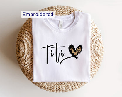 a t - shirt with the word titi printed on it