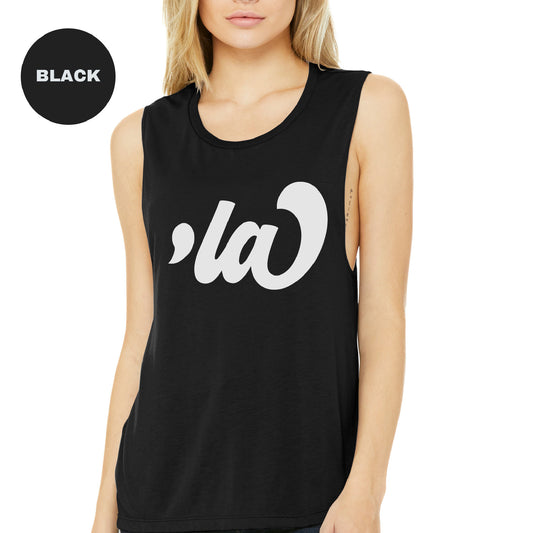 a woman wearing a black tank top with white letters