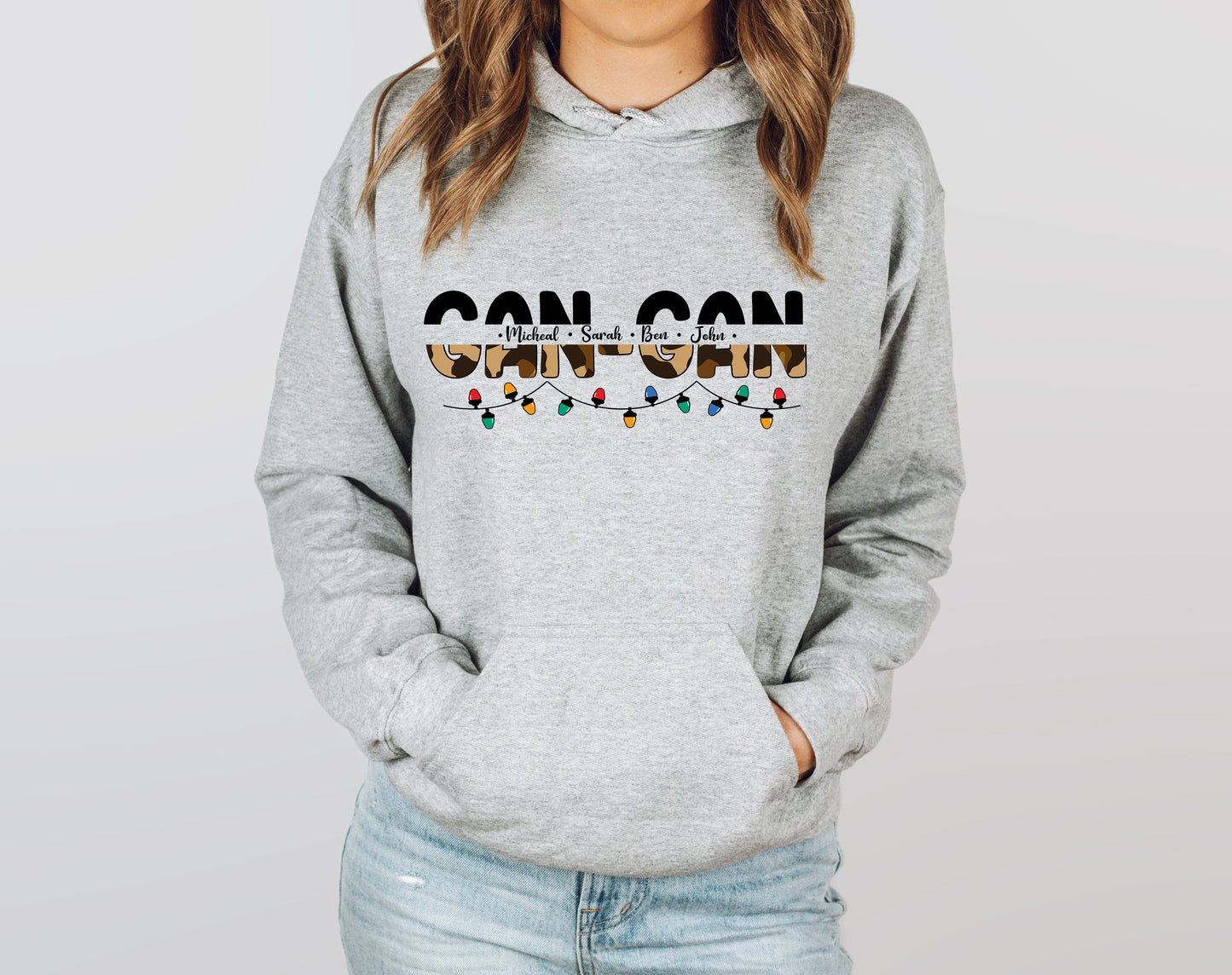 A woman wearing a grey hoodie with the text "GANTZ" printed on it.
