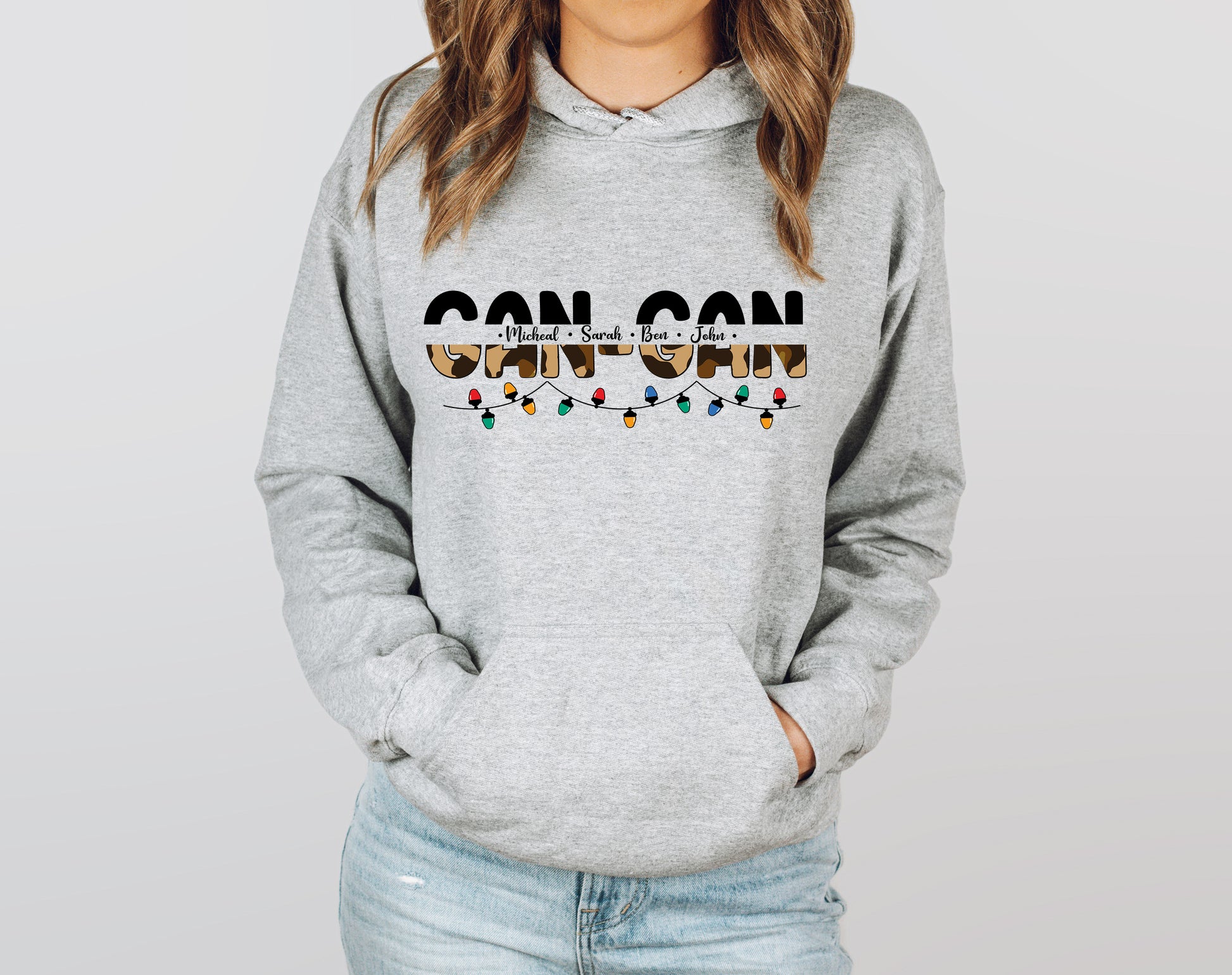 A woman wearing a grey hoodie with the text "GANTZ" printed on it.